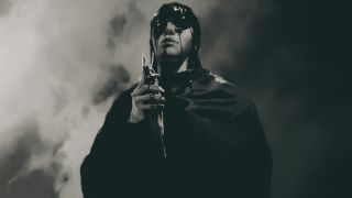 Neyrelle holding the Sapphire Soulstone which contains the essence of Mephisto.